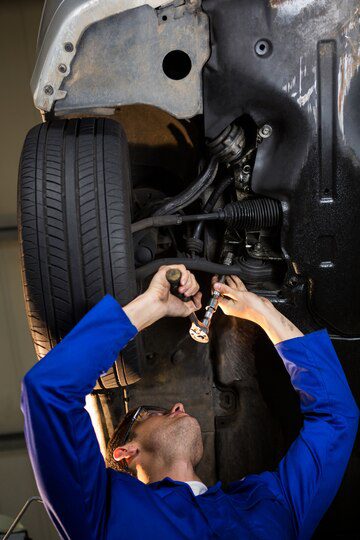 Mechanic servicing a car<br />
