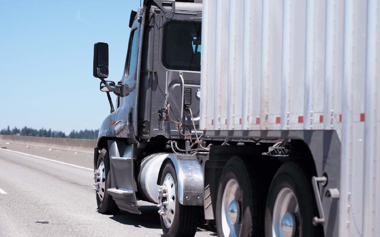 Dark gray big rig day cab semi truck